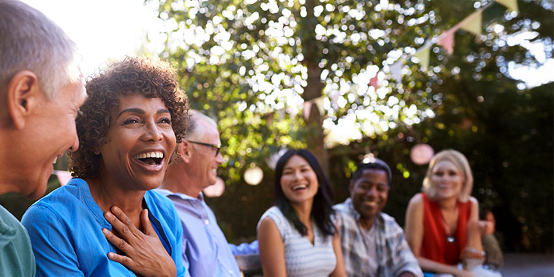 Group of friends enjoying a joyful outdoor gathering.